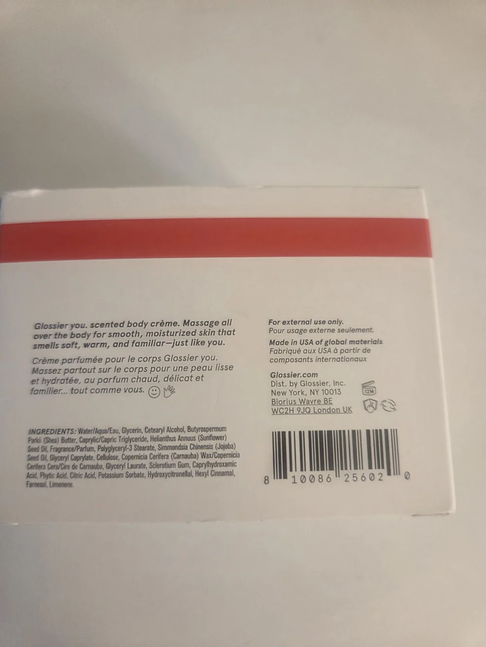 Glossier cream white with red stripe